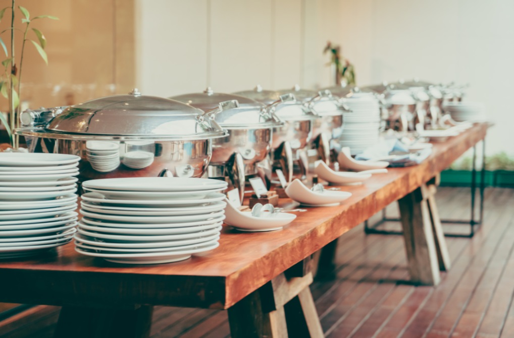 Table set with catering dishes and trays