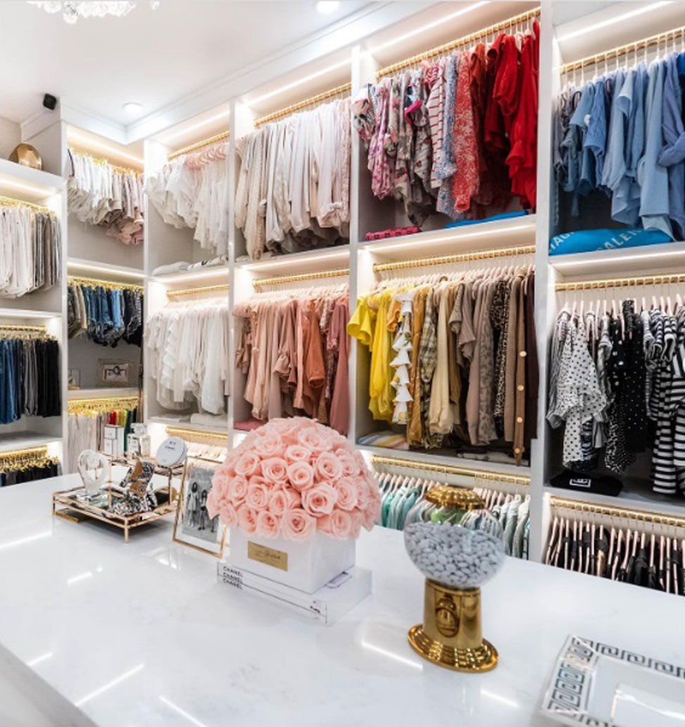 A large closet neatly organized by blocks of color