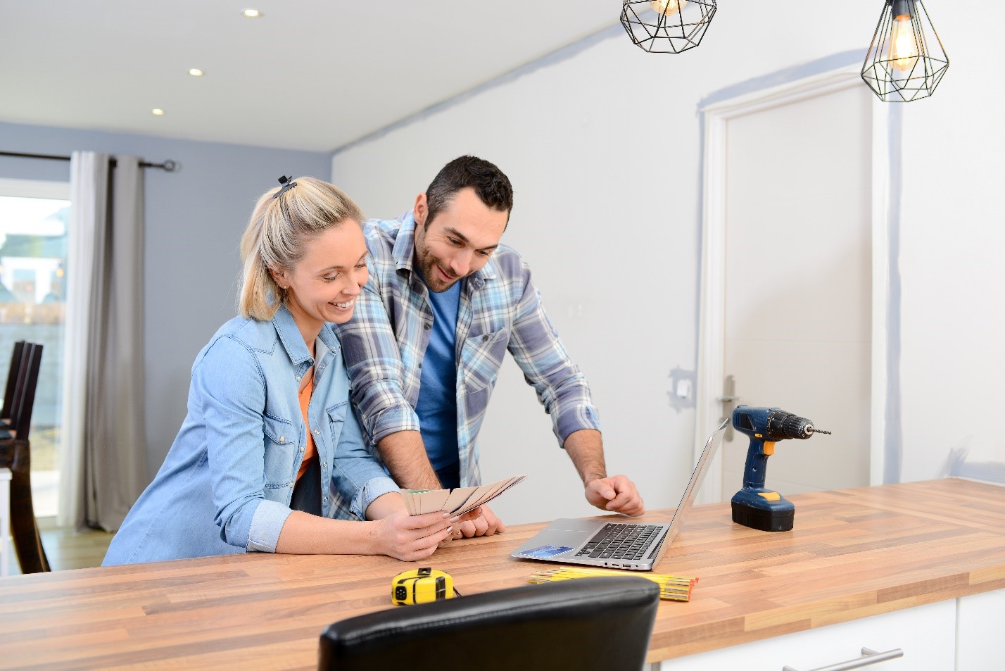 Couple looking at paint colors