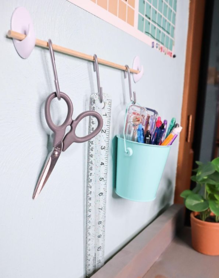 Dorm accessories organized with hooks & command strips