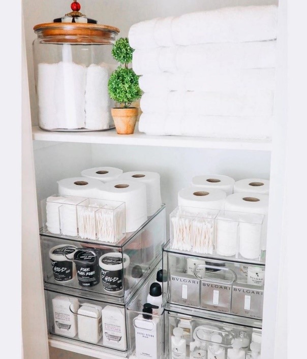 Easily declutter your bathroom closet by using organization bins