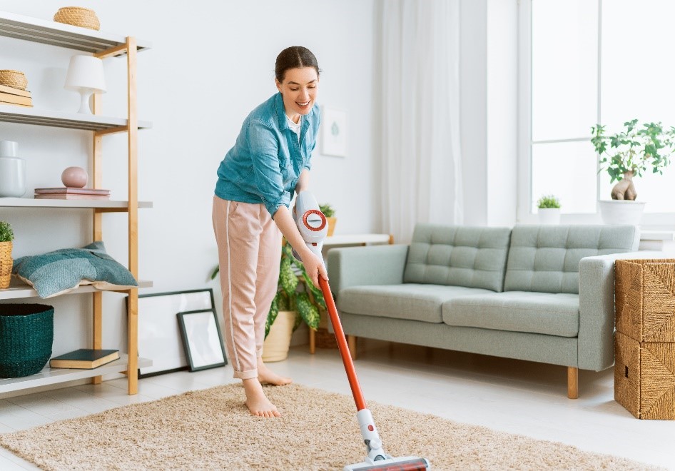 Person cleaning their rug