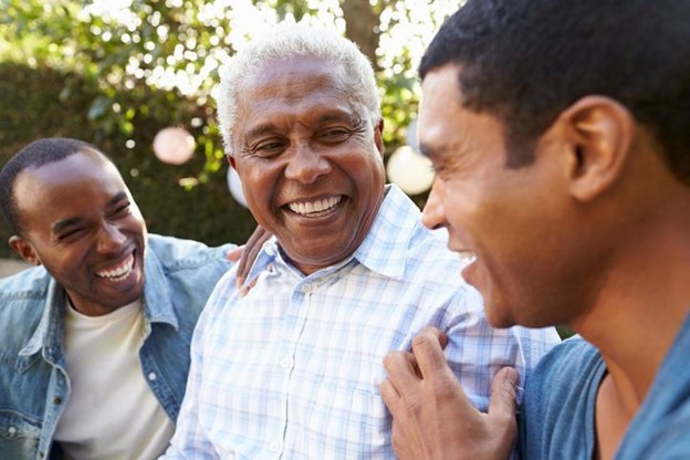 A man talking and laughing with his dad