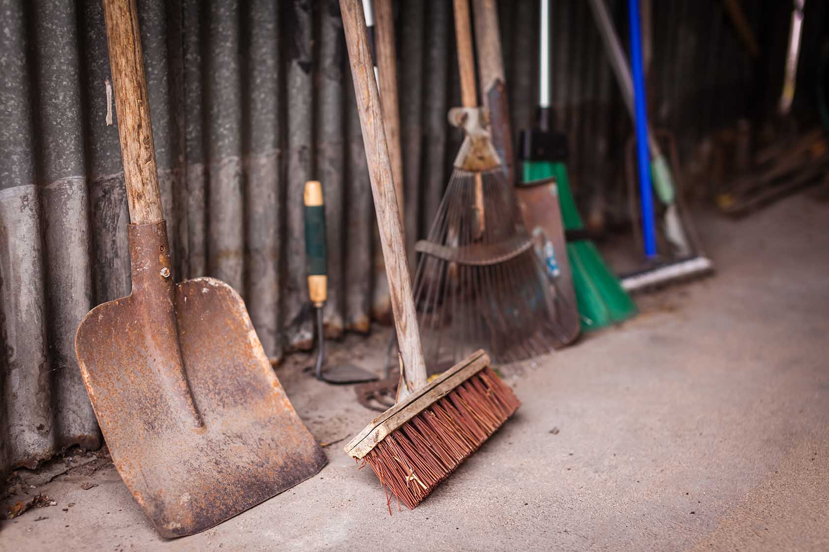 Gardening tools lined up in garage