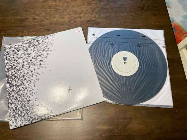 A double-sleeved vinyl record on a table